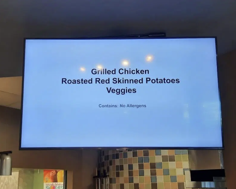 Police photo of the menu screen showed the meal's description, which included grilled chicken, roasted potatoes, and veggies, with a line underneath stating that it did not contain any allergens.