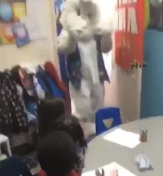 As seen in the doorway, the Easter Bunny startled all the children, resulting in a video filled with tears.